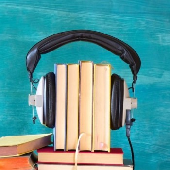 Large heap of books and heaphones, audio books concept, entertainment and education during corona lockdown